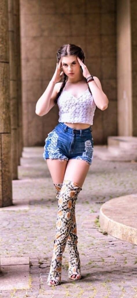 denim shorts with thigh high boots