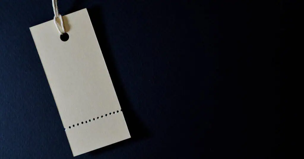 Elegant minimalist card with a string, ideal for labeling or pricing against a black background.