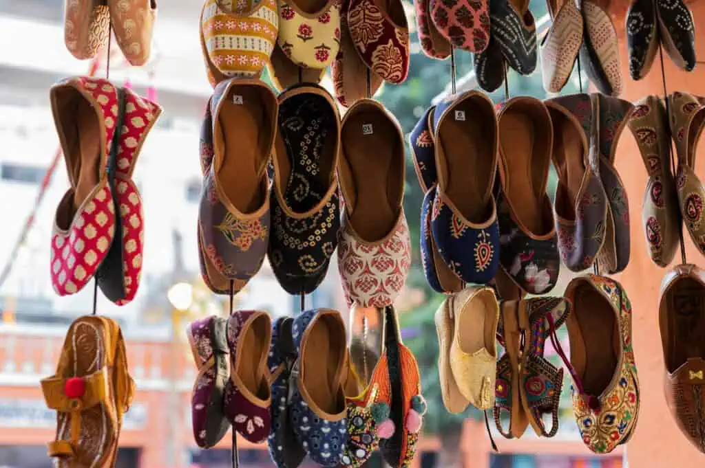 Vibrant traditional Indian juttis on display, showcasing cultural heritage in Jaipur.